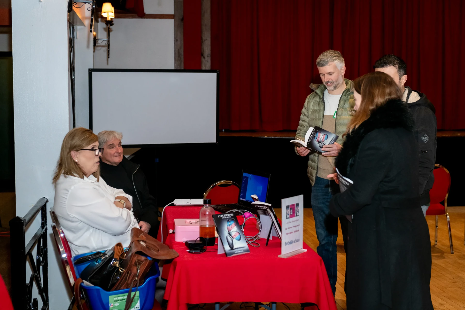 A reader leafing through A Life Rewritten