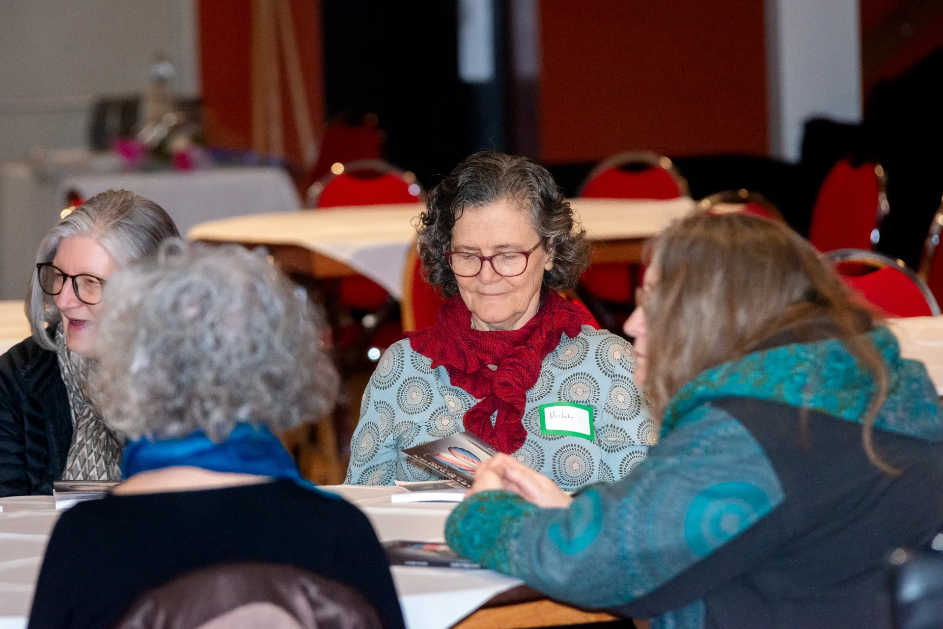 Attendees chatting at the Germania Club event