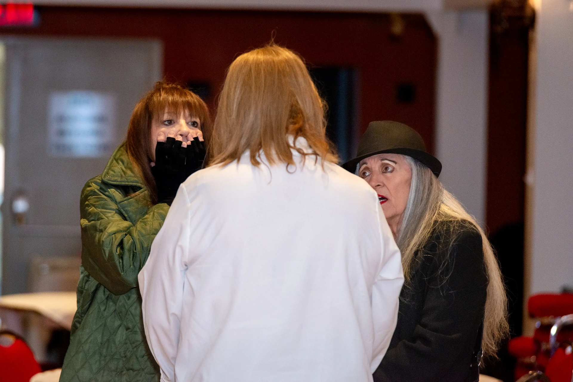 Three guests engaged in lively conversation